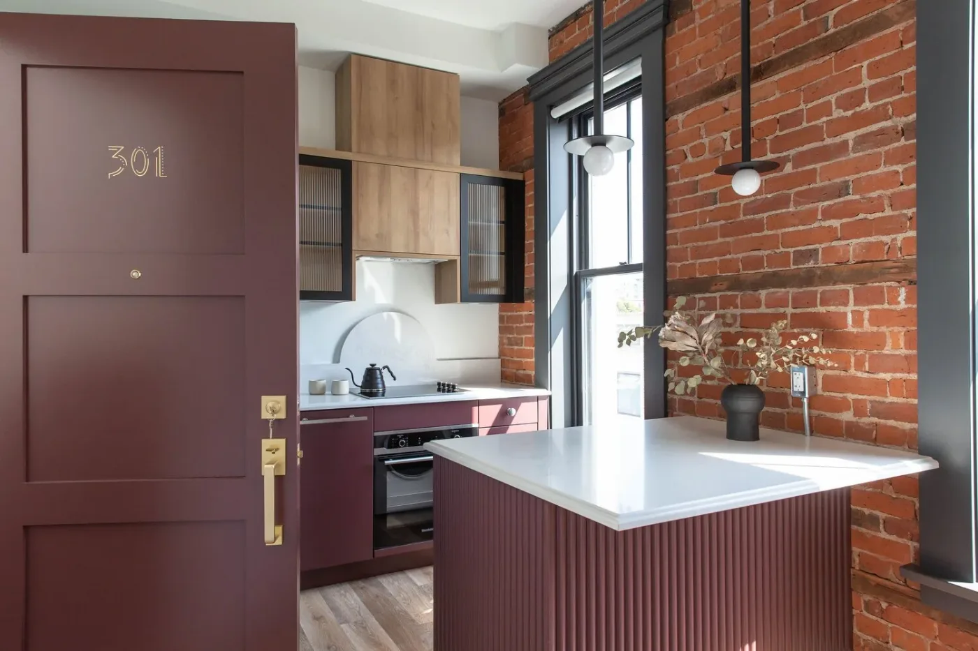 The purple door onto 301, brick and open shelving beyond