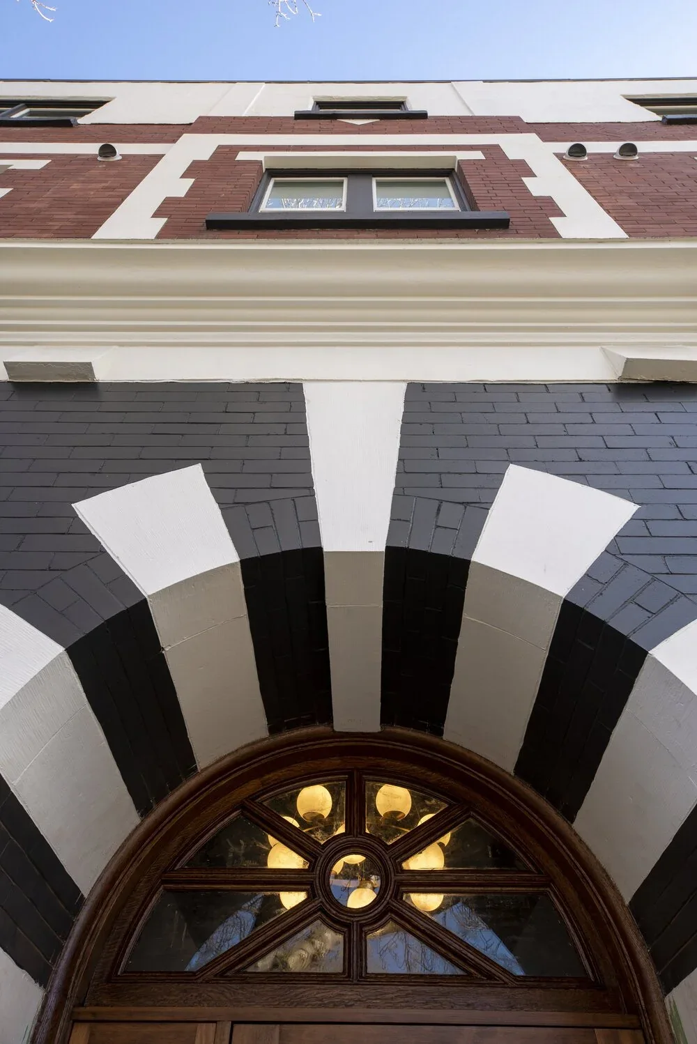 The painted arch over the entrance, lit from within
