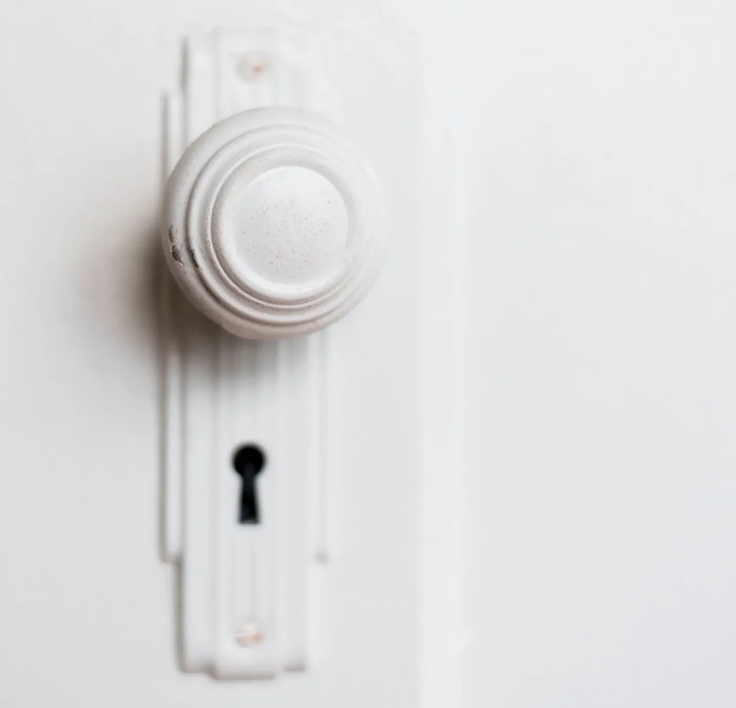 An original door knob and escutcheon at Bell Apartments