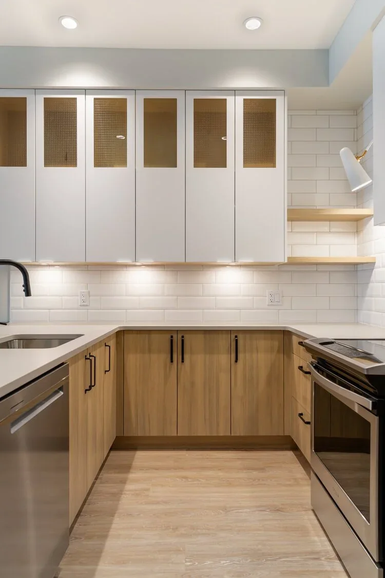 Kitchen with pale wood cabinetry in a Meares Street townhouse