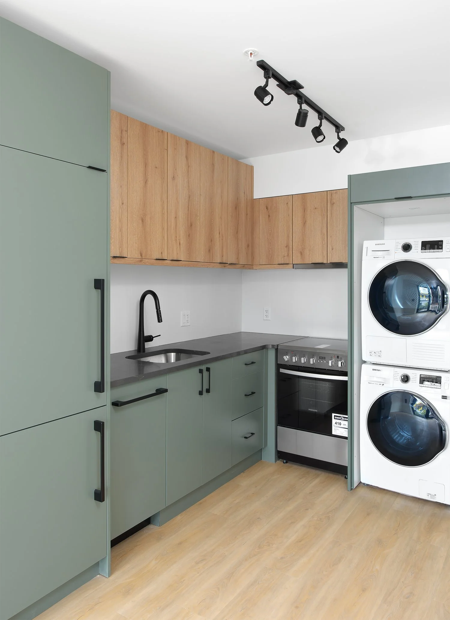 In-home washer and dryer built in beside the kitchen