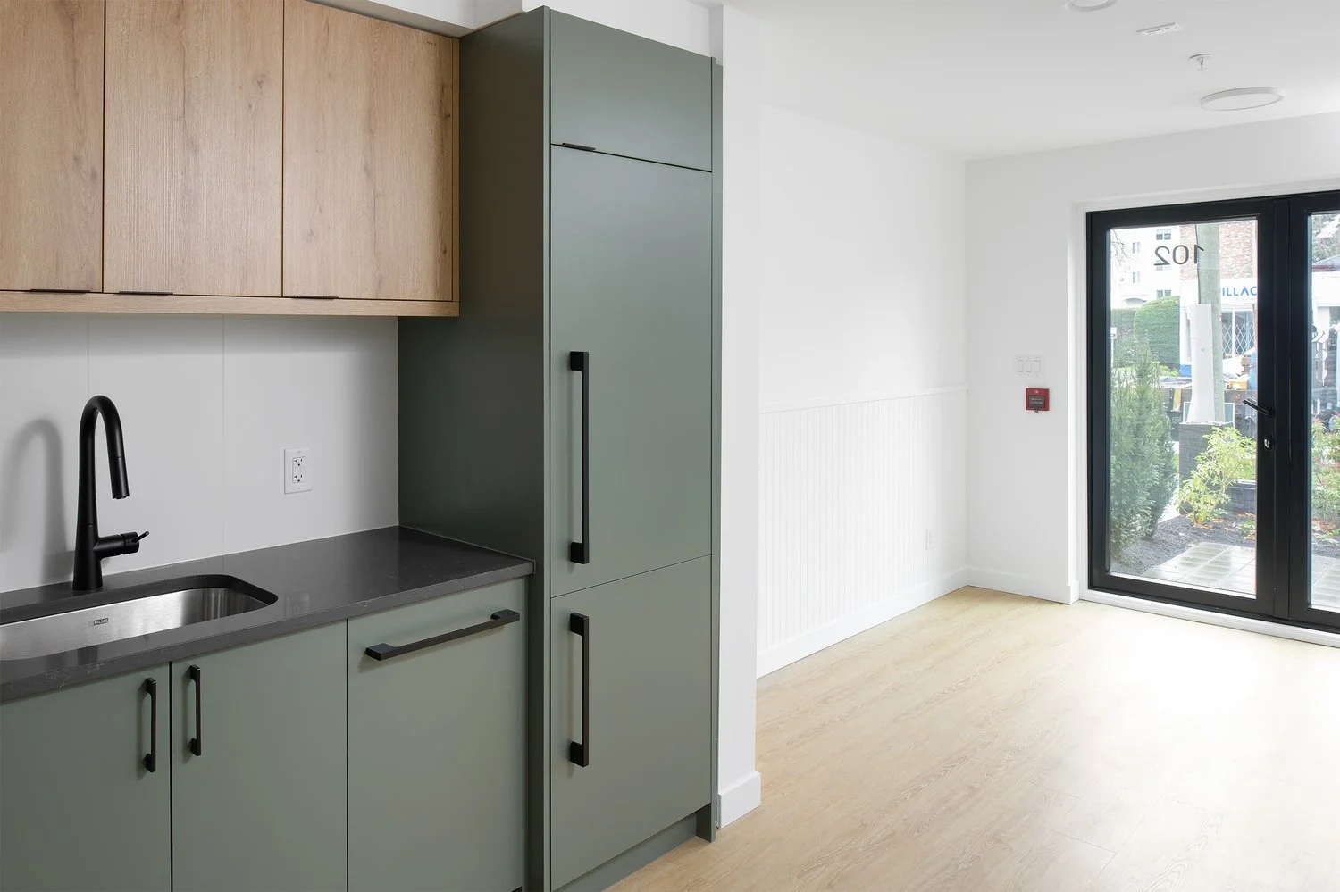 A live/work space with its own kitchen and tall street-facing windows