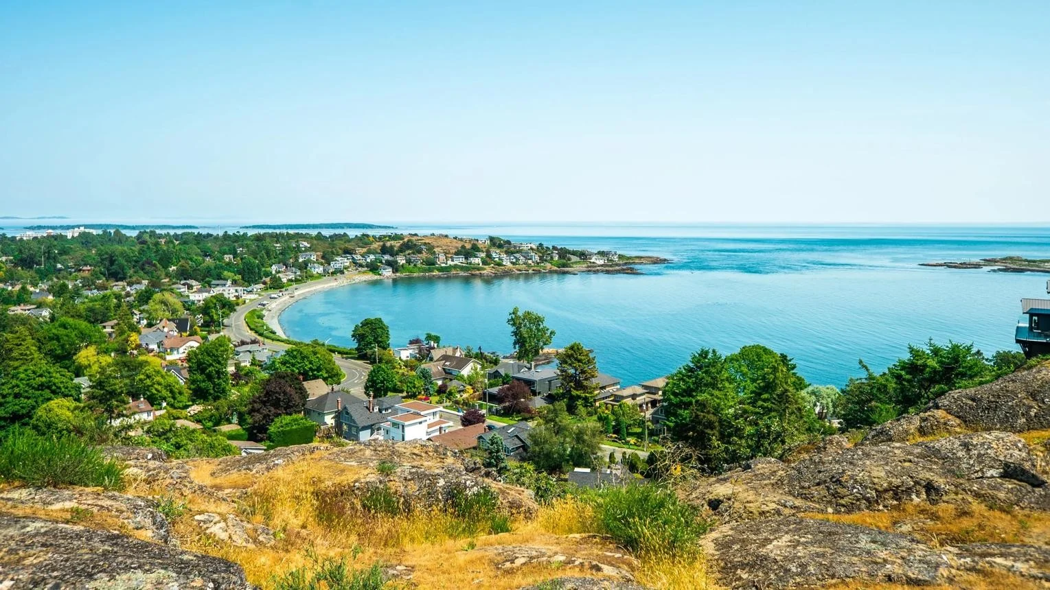 The bay below Gonzales Hill — houses along the shore and the Salish Sea beyond