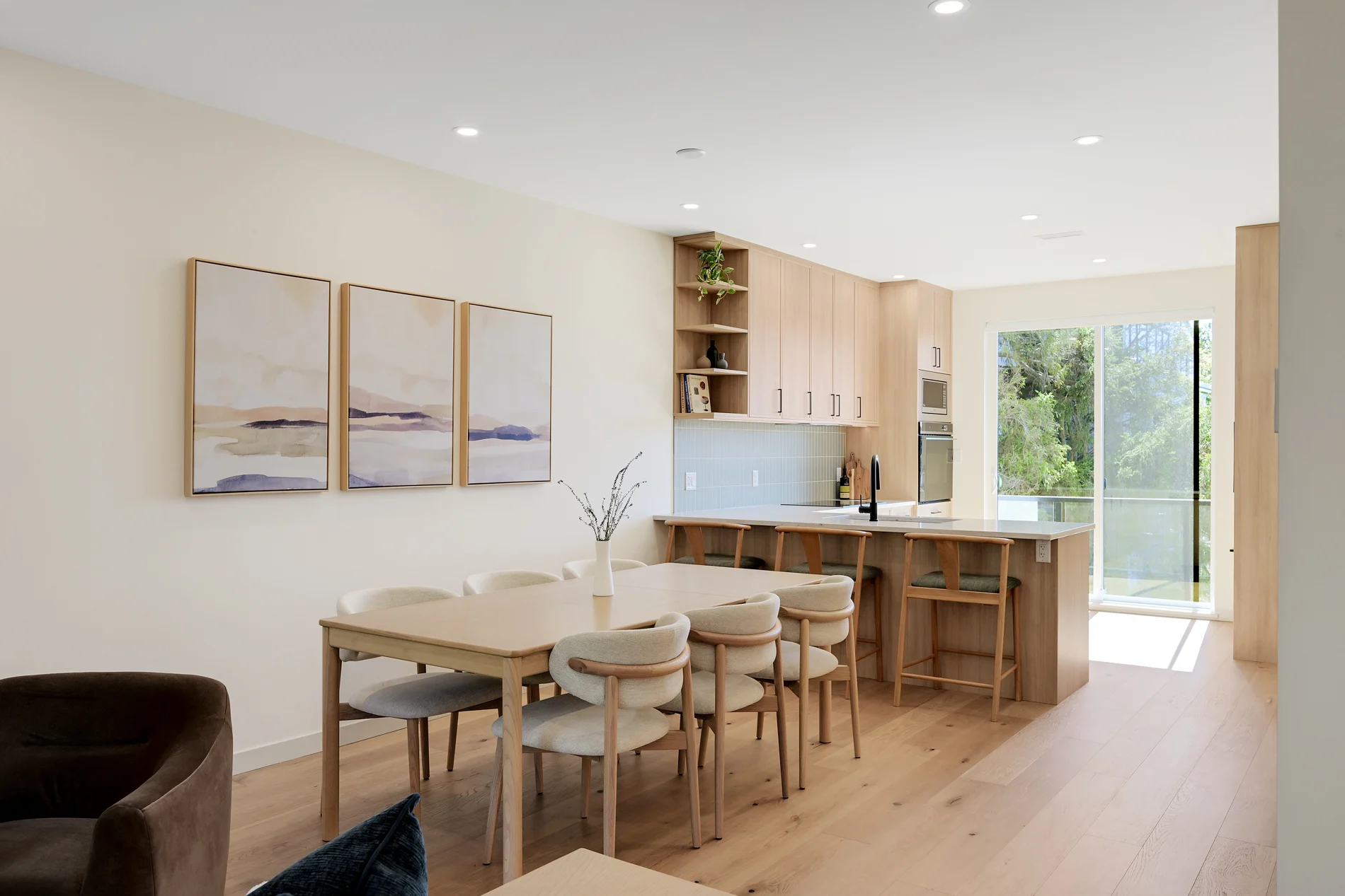 Dining table and kitchen island under the windows