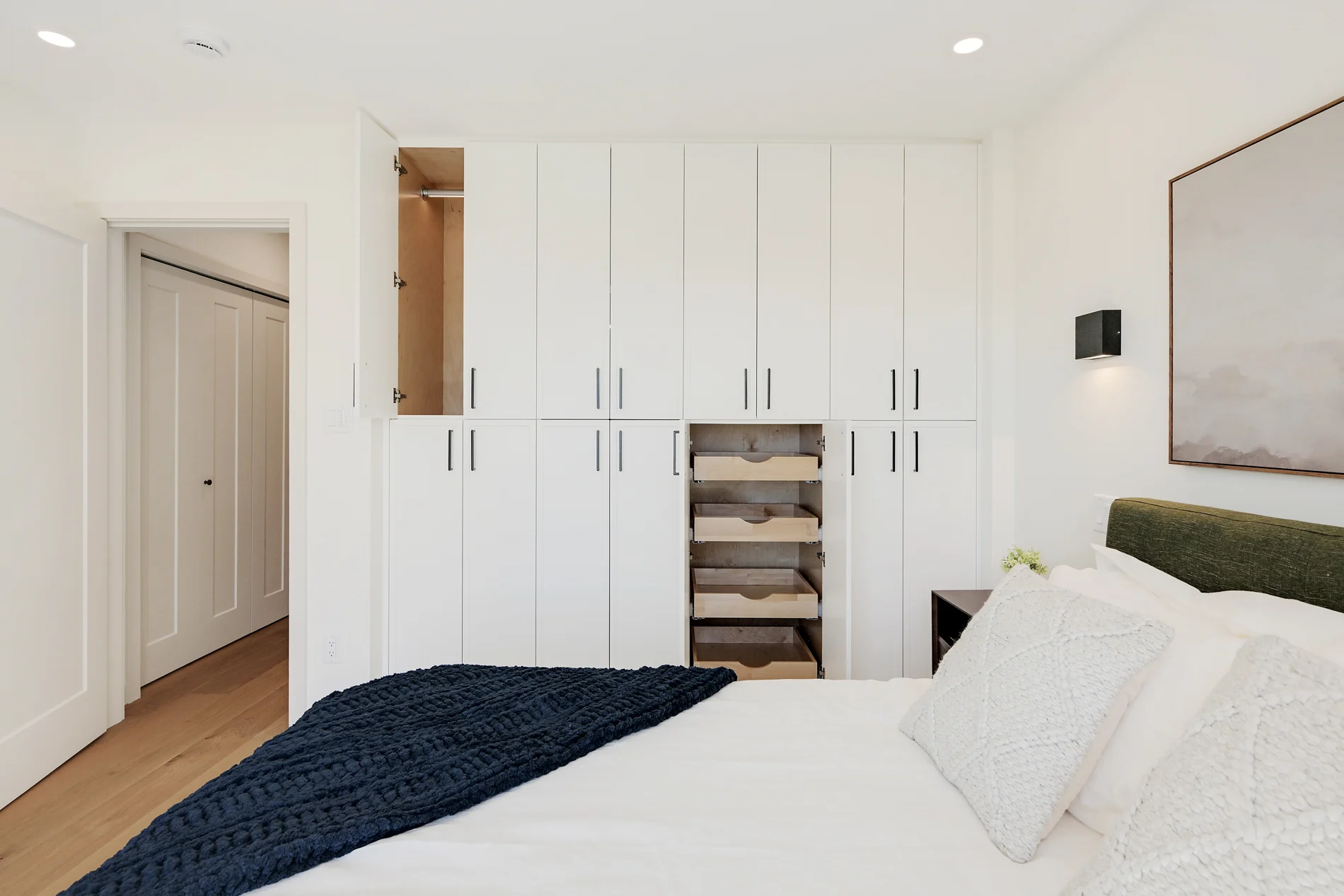A bedroom with built-in wardrobes