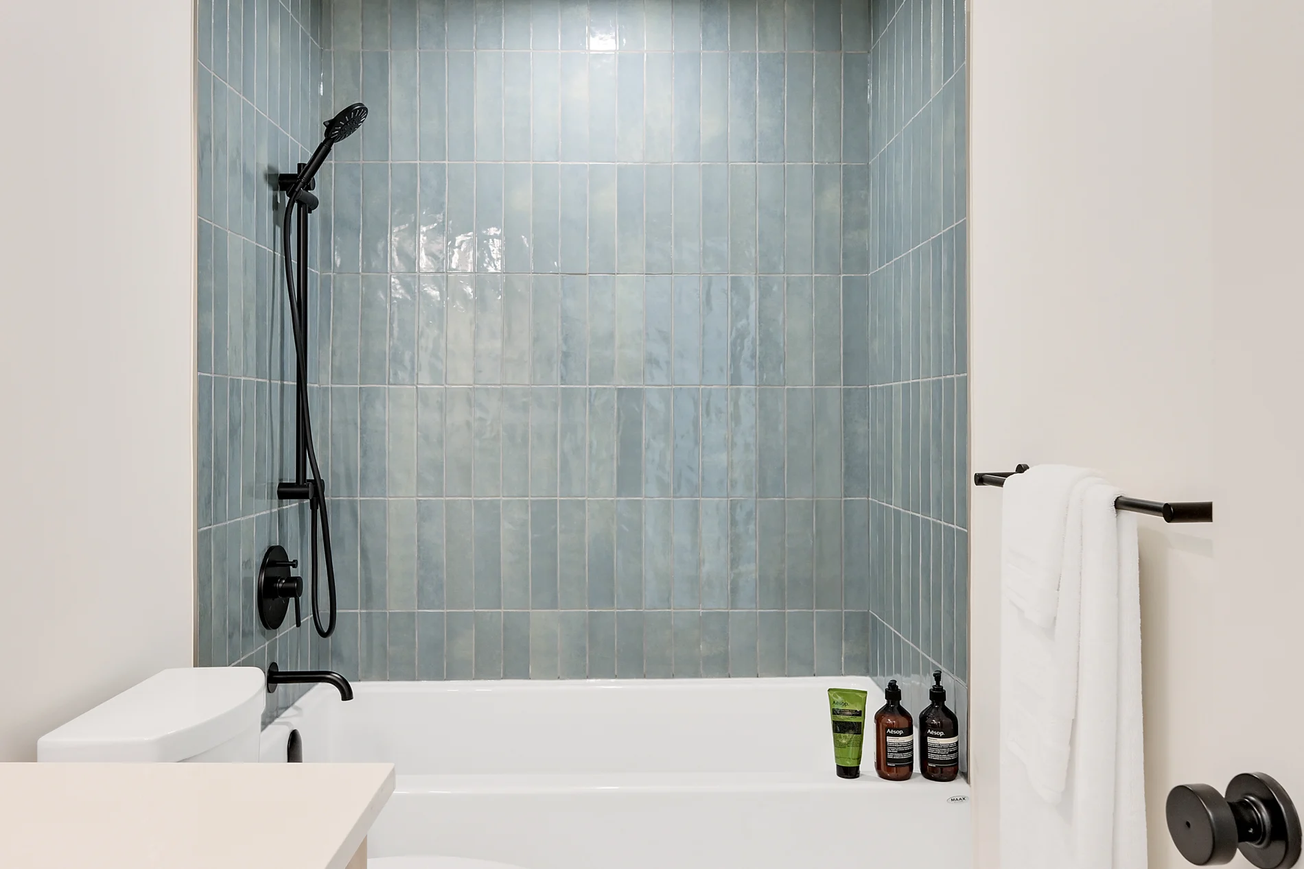 The bath, with its tiled surround