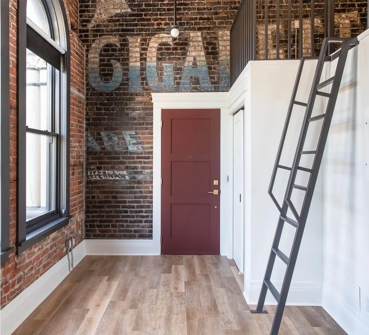 Restored brick interior with original painted signage