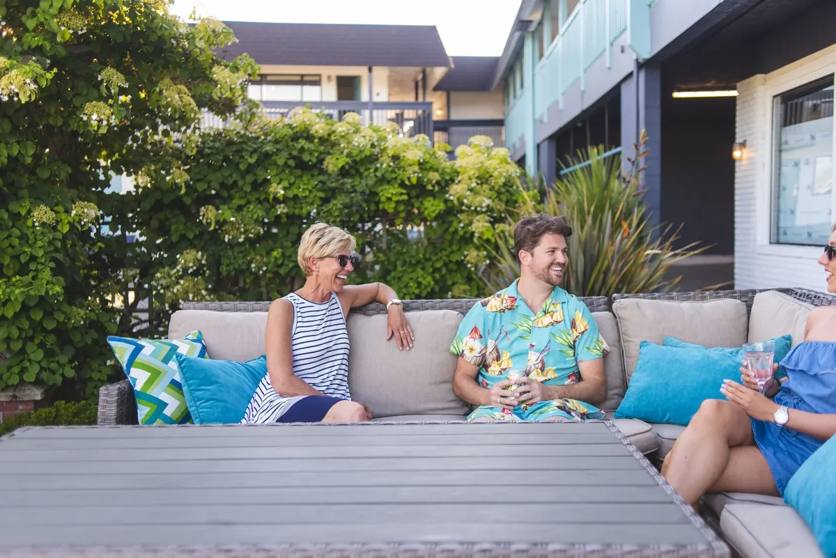 Residents talking on an outdoor sofa