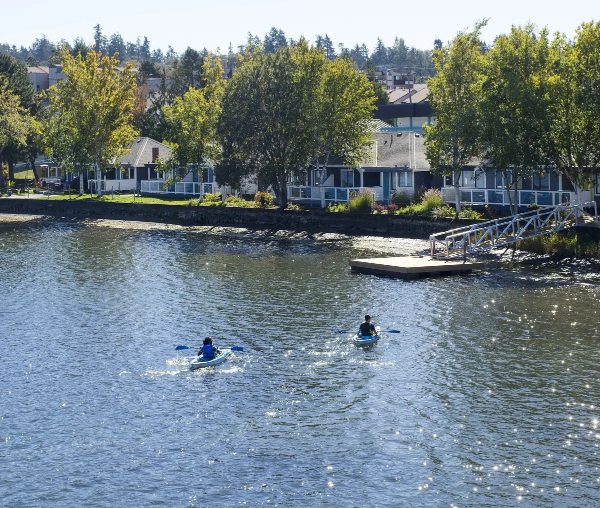 Kayakers on the Gorge in front of the buildings