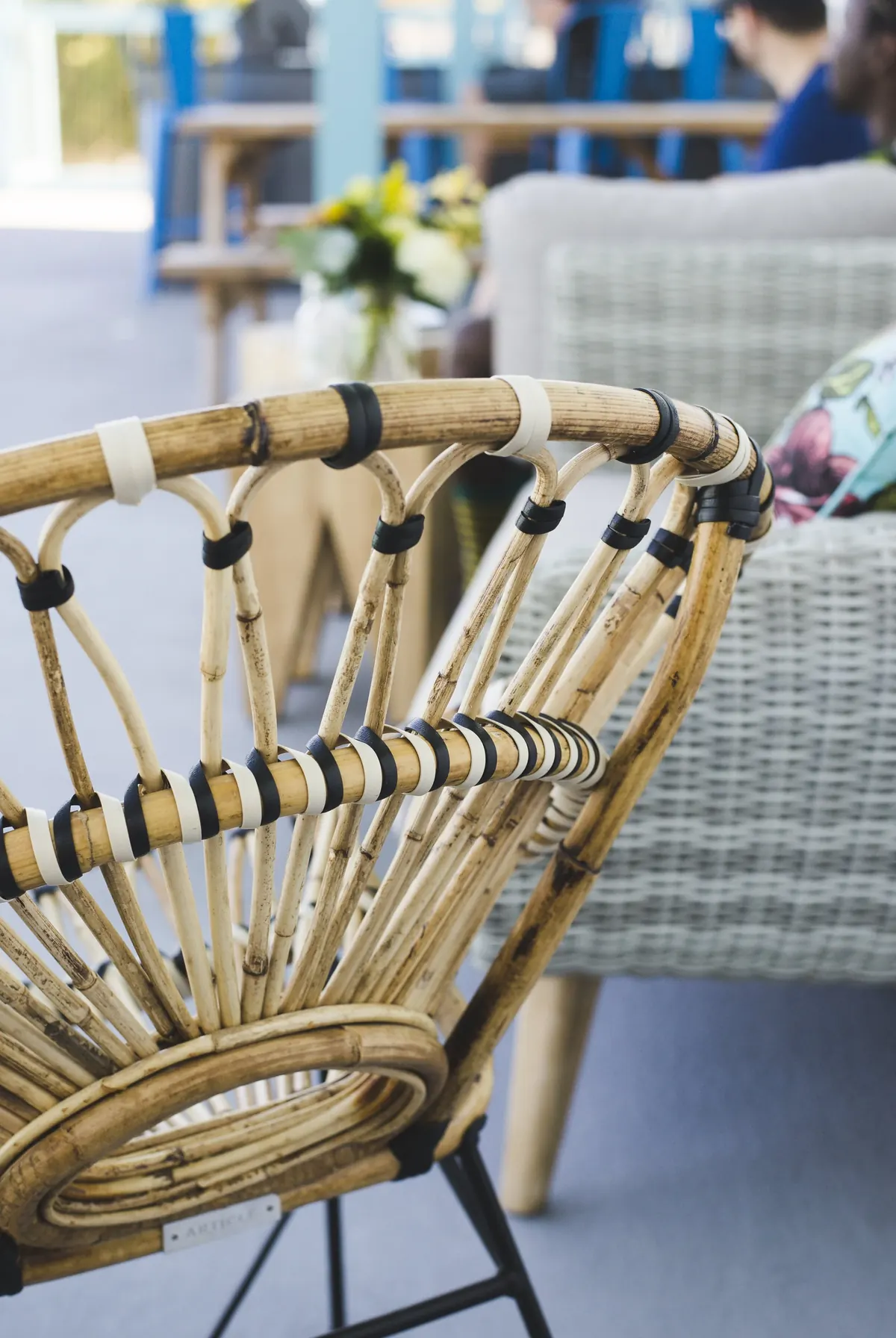 A cane chair and table in the lounge