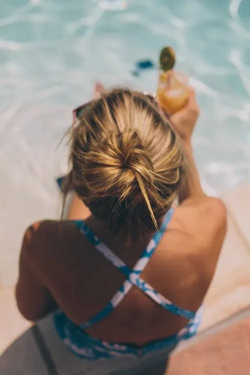 A swimmer at the edge of the pool